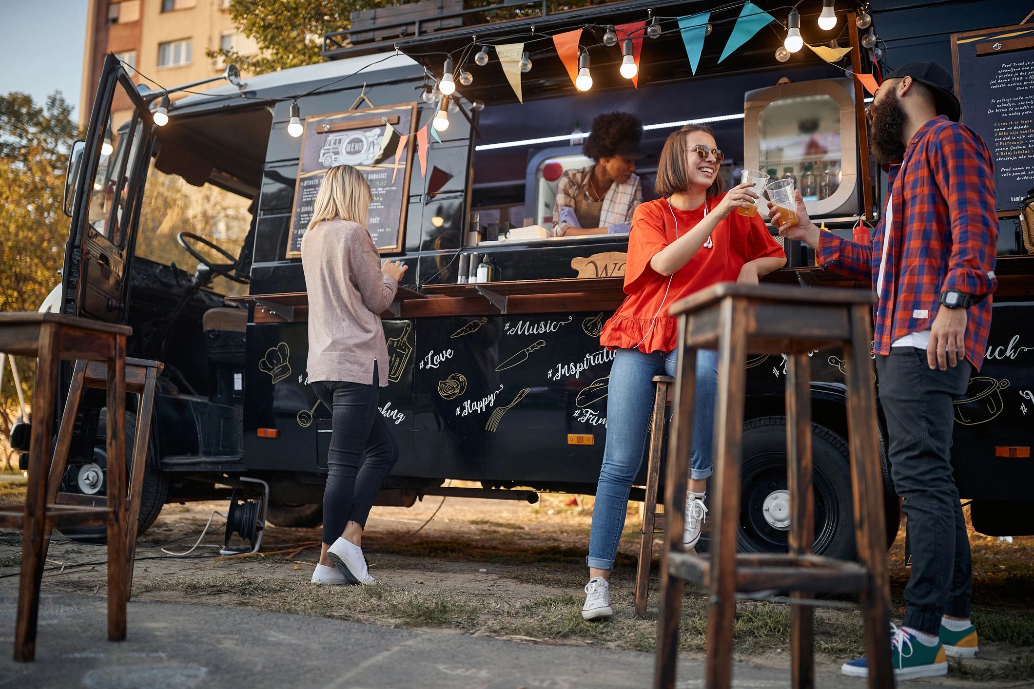 Guests gathered near a mobile service truck at an outdoor event