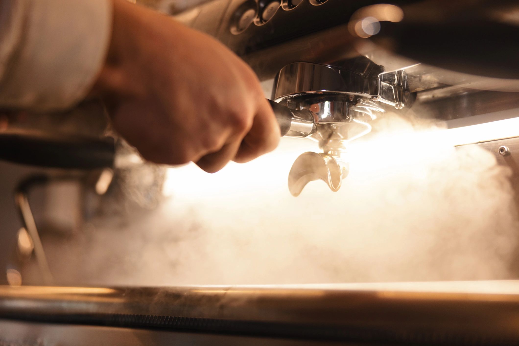Espresso being pulled on a professional machine