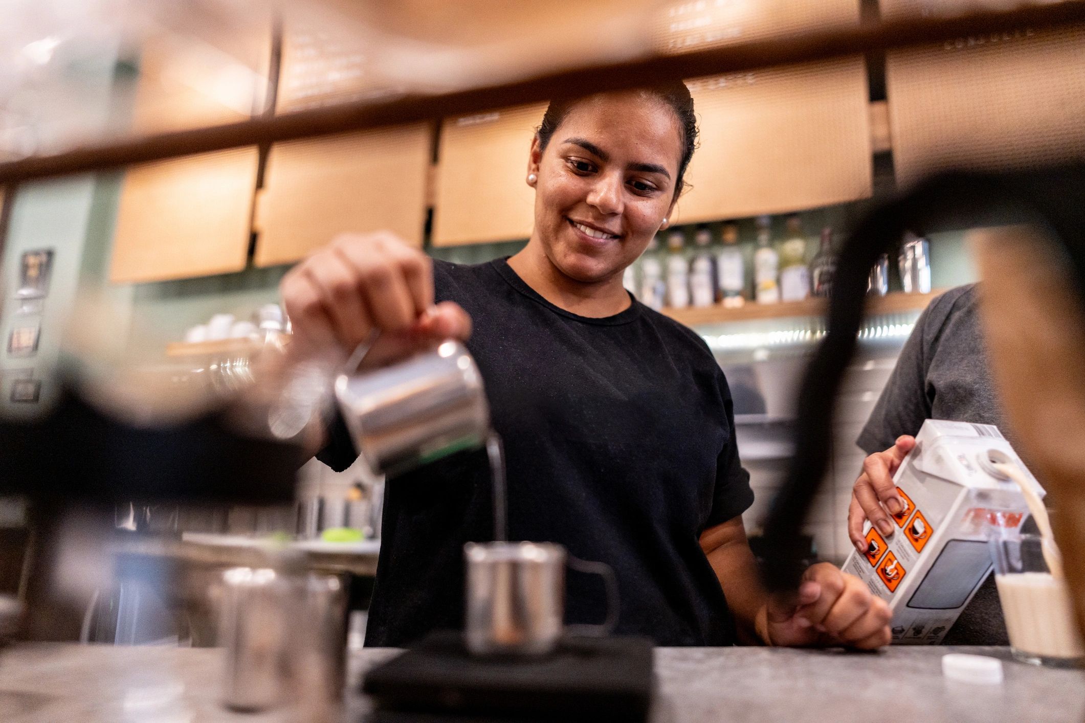 Coffee service station with barista preparing drinks
