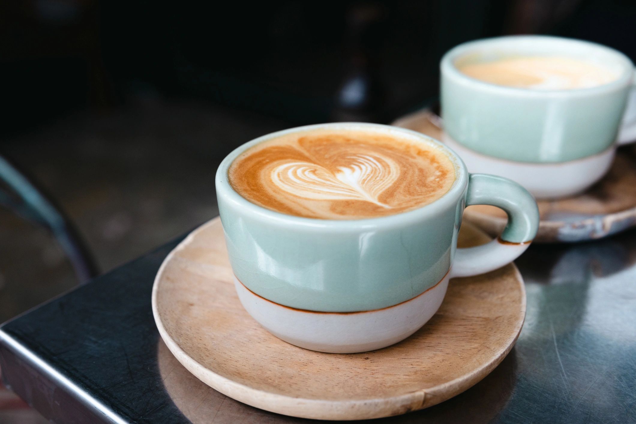 Latte with heart-shaped latte art on a table